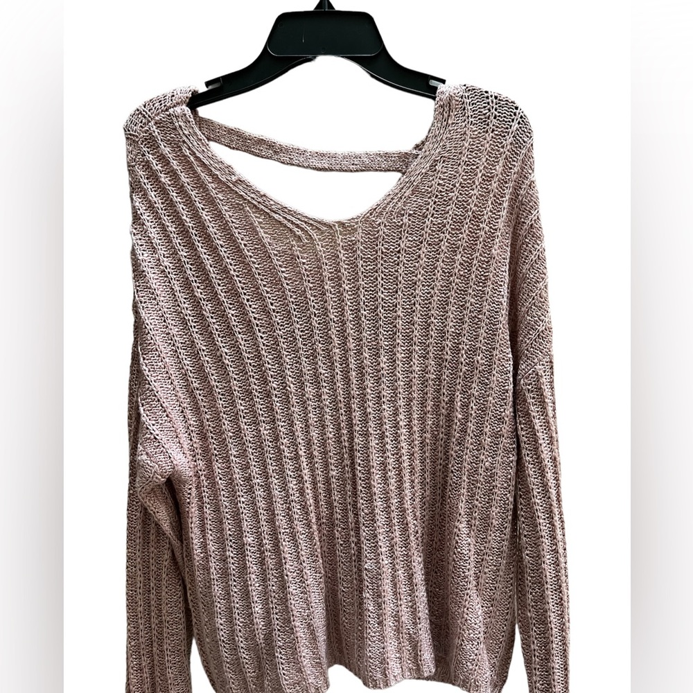 Light pink sweater with a small open back by “So”